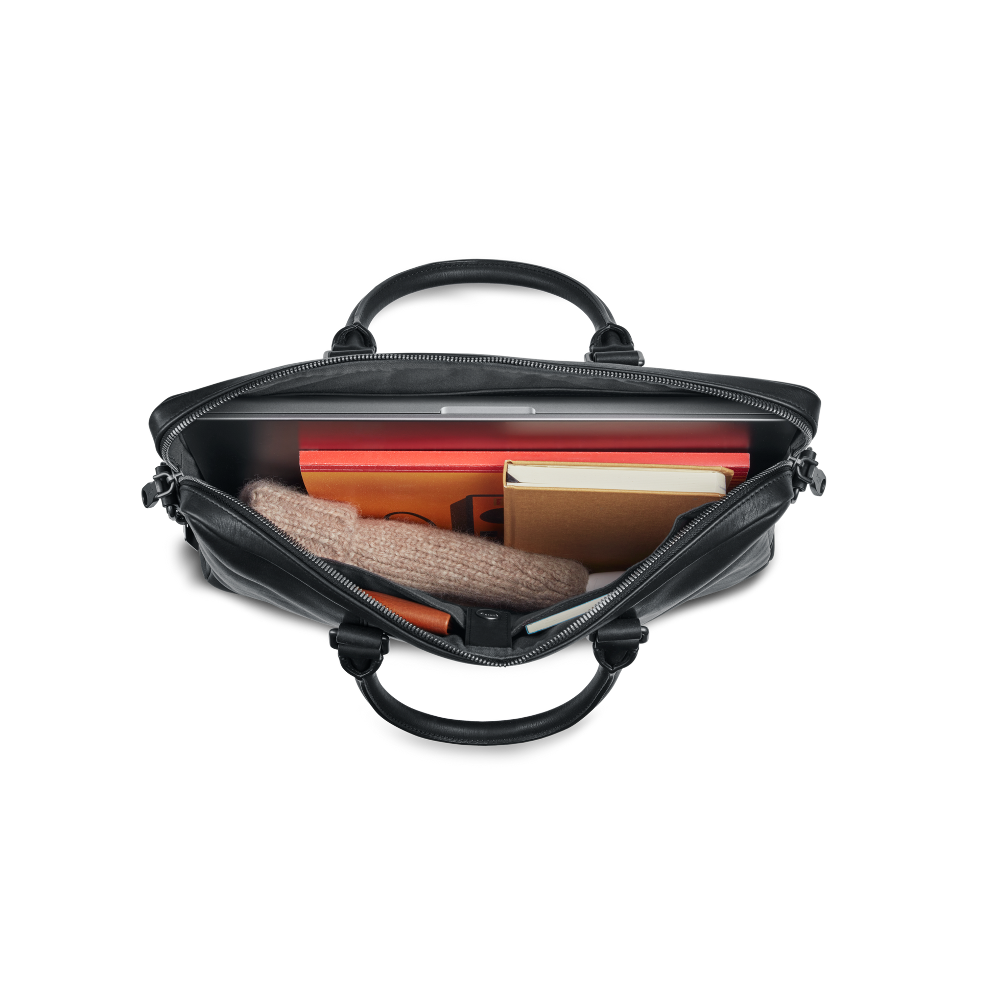 Top view of an open nicelaundry-jp.computer Briefcase - Black holding a folded beige sweater, closed laptop, red folder, orange notebook, and yellow book against a white background.