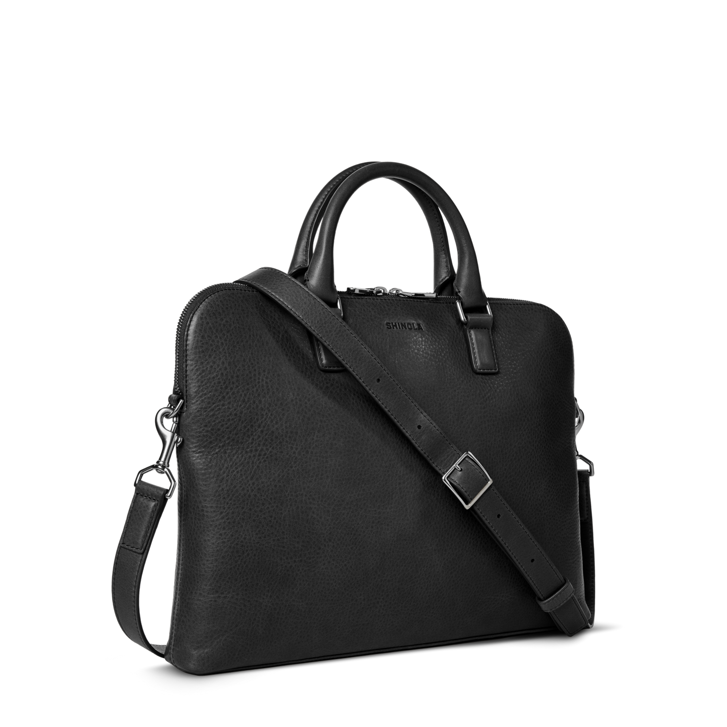 The Shinola Portfolio Briefcase - Black is a leather laptop briefcase with two handles, a detachable shoulder strap, silver hardware, and zipper closure, shown on a plain white background.