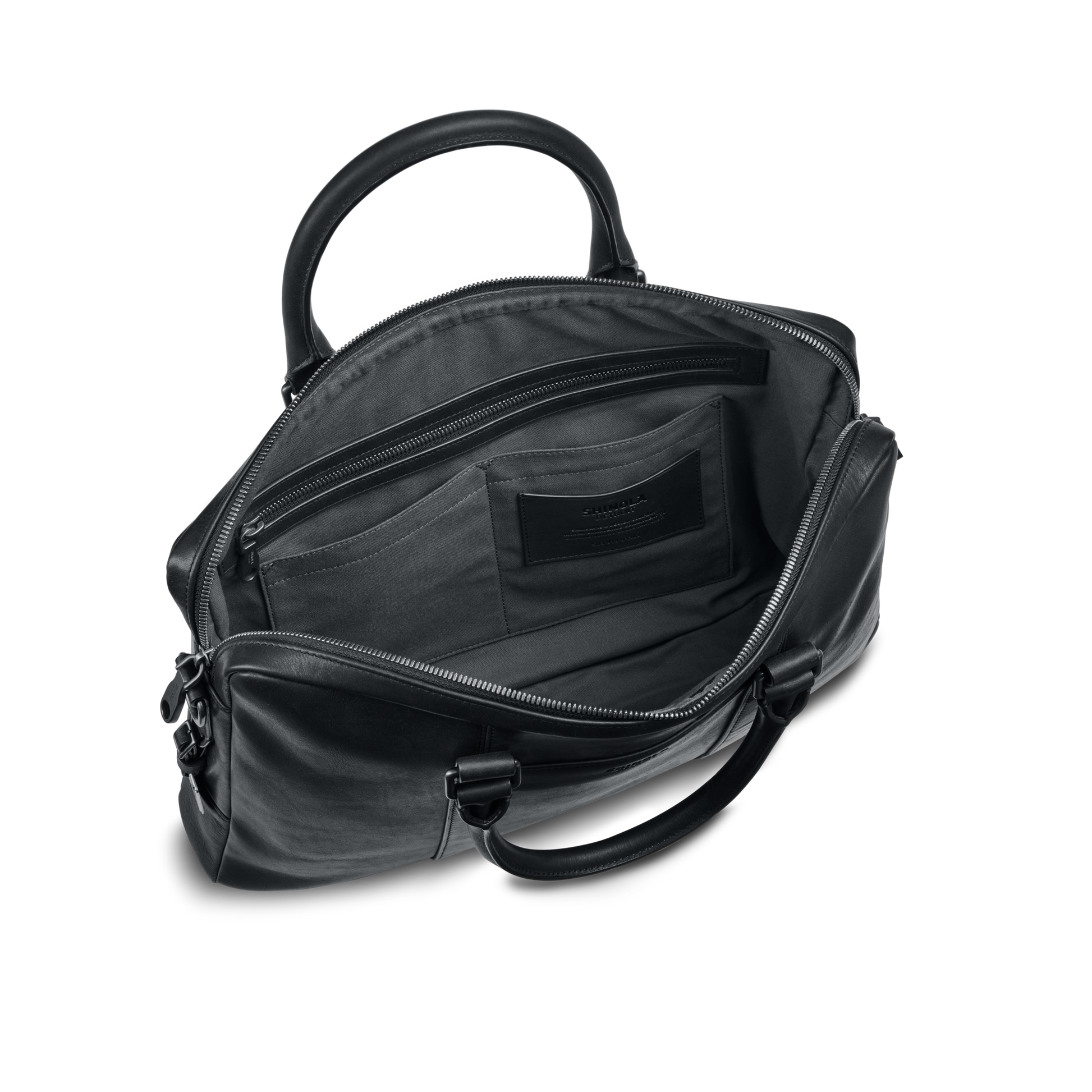 The nicelaundry-jp.computer Briefcase - Black is shown open, displaying its spacious interior with multiple pockets. Featuring silver zippers, two sturdy handles, and a sleek modern design, it’s ideal as a stylish work bag.