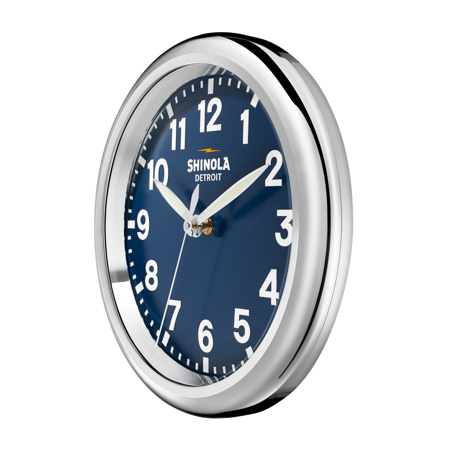 The 14" Runwell Clock - Navy by Shinola features a round shiny silver frame, dark blue face, white numbers and hands, reads 1:50, and displays the Shinola Detroit brand name on the dial.