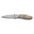 The Shinola + Kershaw Petoskey Stone Pocket Knife features a sharp silver blade and a beige-brown patterned Petoskey Stone handle, with Shinola branding near the hinge, shown on a white background.