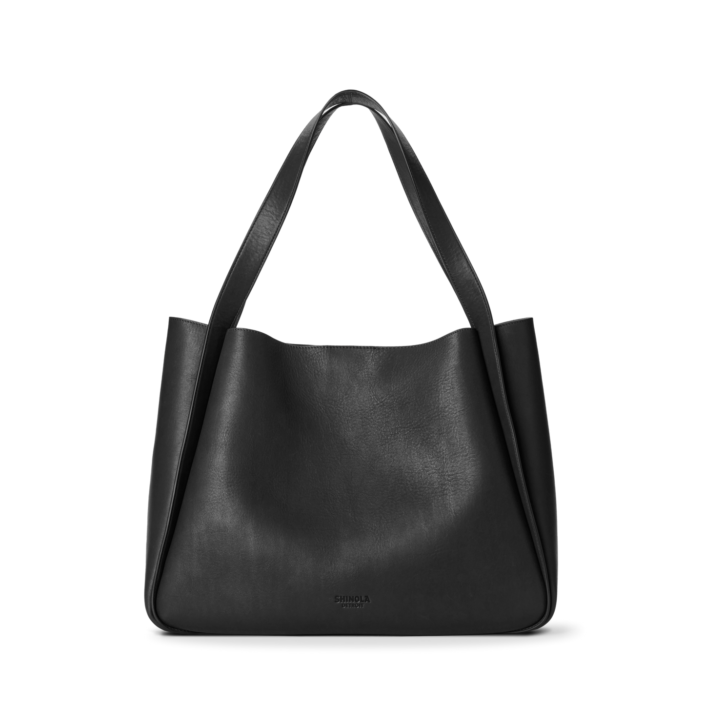 The Shinola Derby Tote Bag - Black is crafted from natural leather with wide, flat shoulder straps and a smooth, minimalist design. This soft-structured everyday bag features subtle branding near the bottom center.