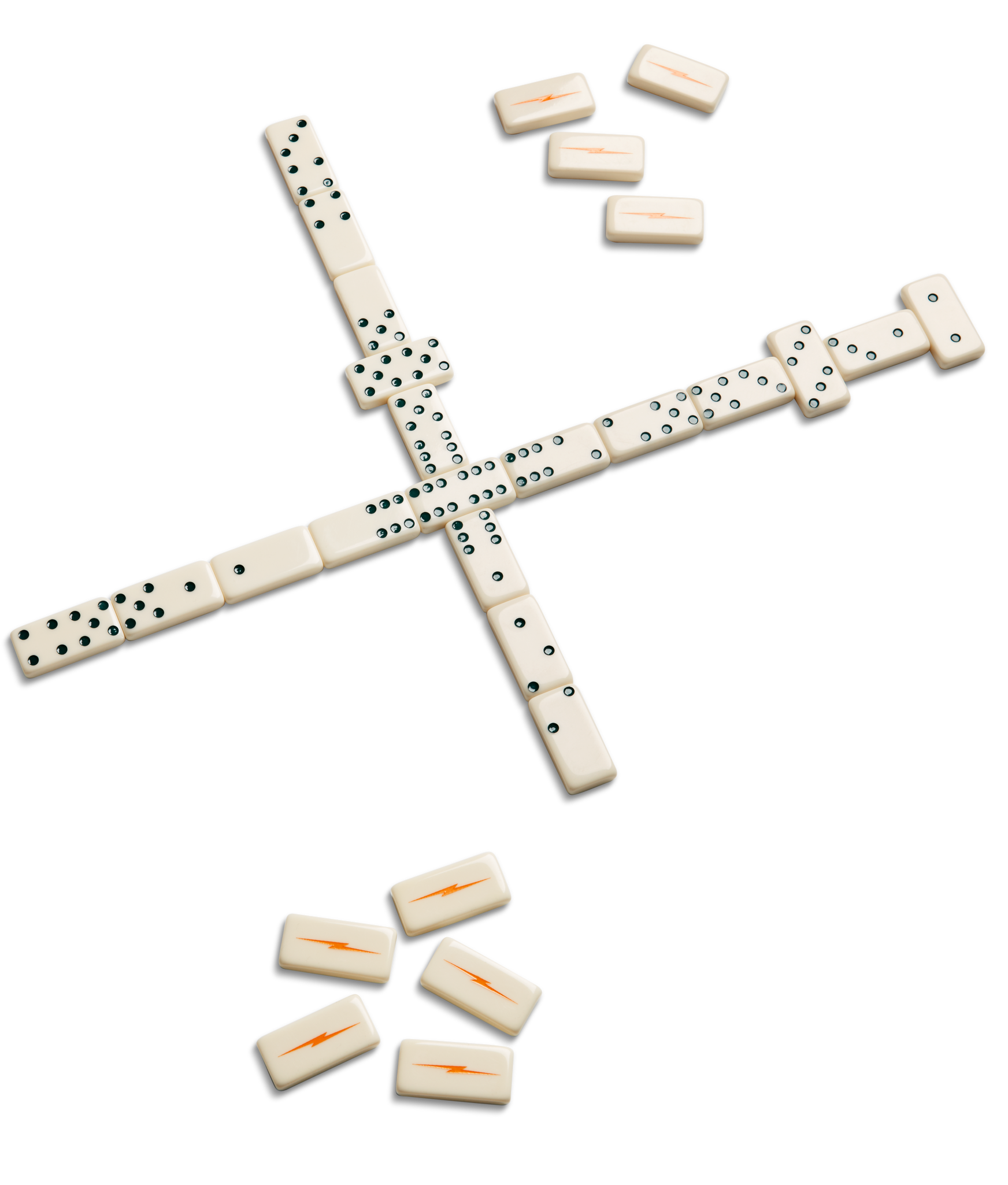 The Shinola Dominoes Set - Cream / Blue features several hand-painted dominoes arranged in a cross on a white surface, with extra dominoes and blank tiles showing orange lightning bolt symbols scattered nearby.
